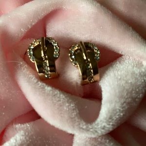 Gold tone and diamond (CZ) buckle earrings.